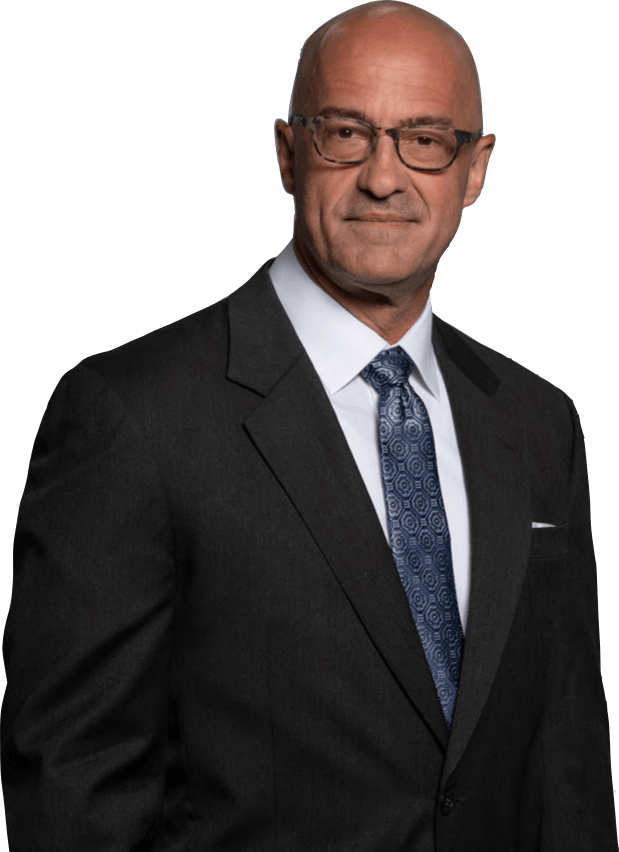 Gentleman wearing glasses and a dark suit