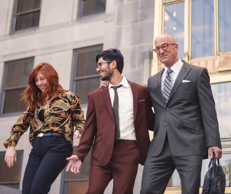 Three people walking down some steps